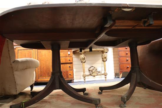 A George III mahogany twin pillar dining table, circa 1800, extends to 12ft 3in. x 5ft 2.5in.